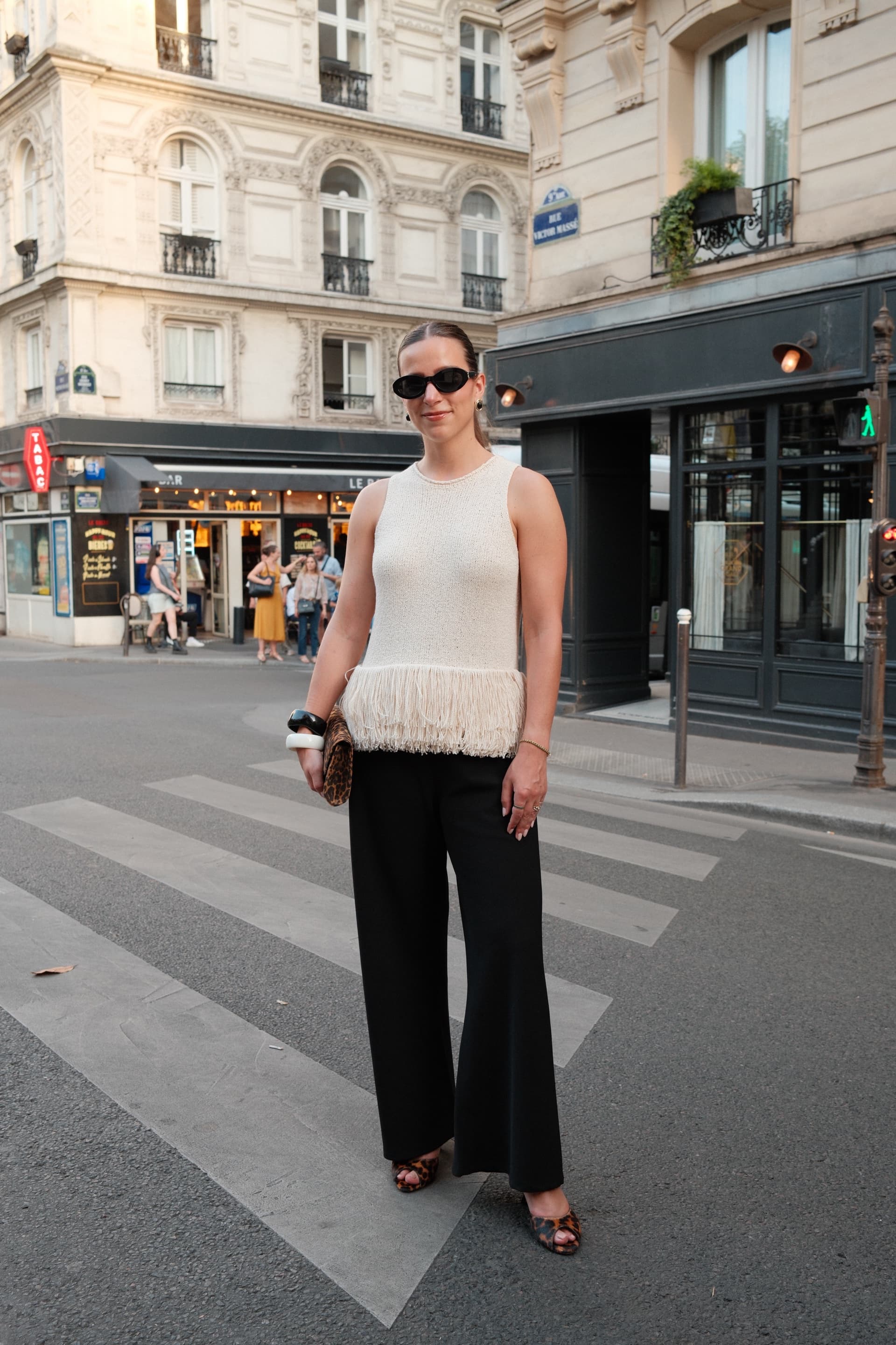 Erika Schatz in a cream knit top and black trousers.